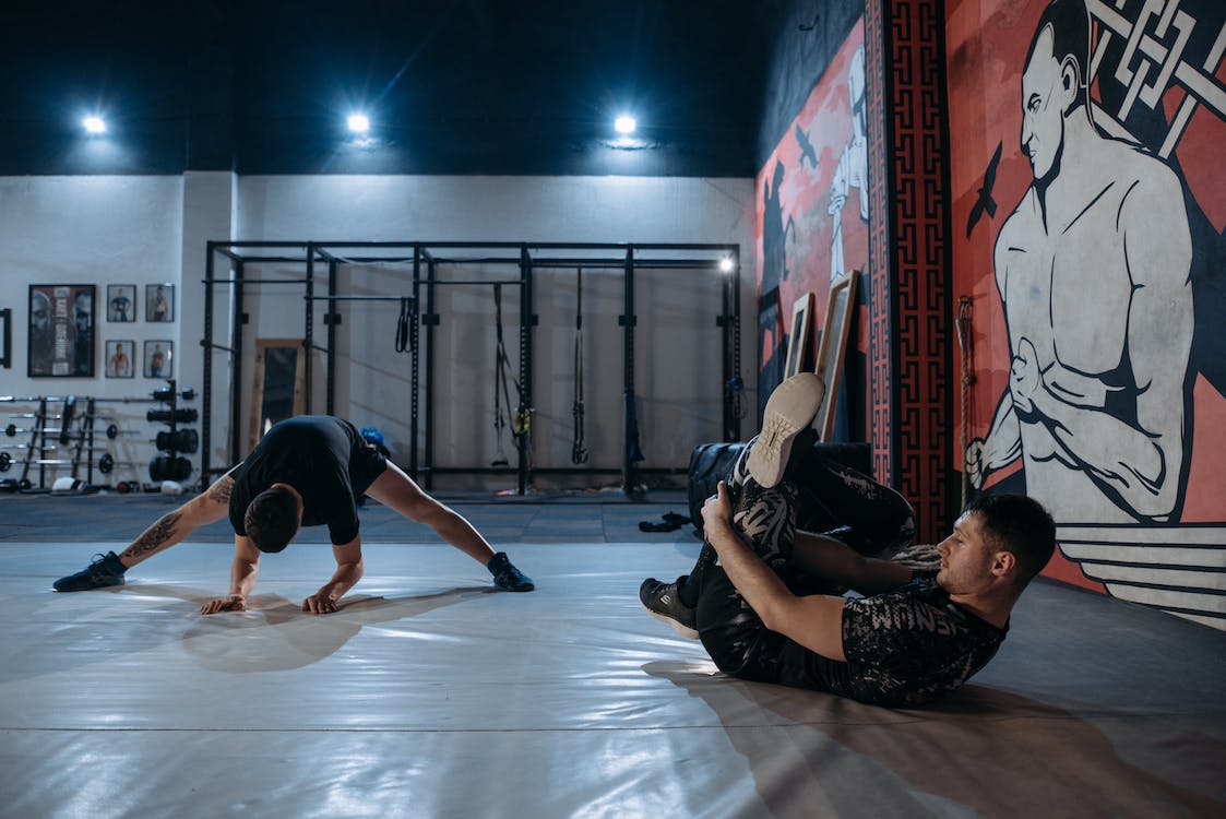 Two wrestlers in flexibility training
